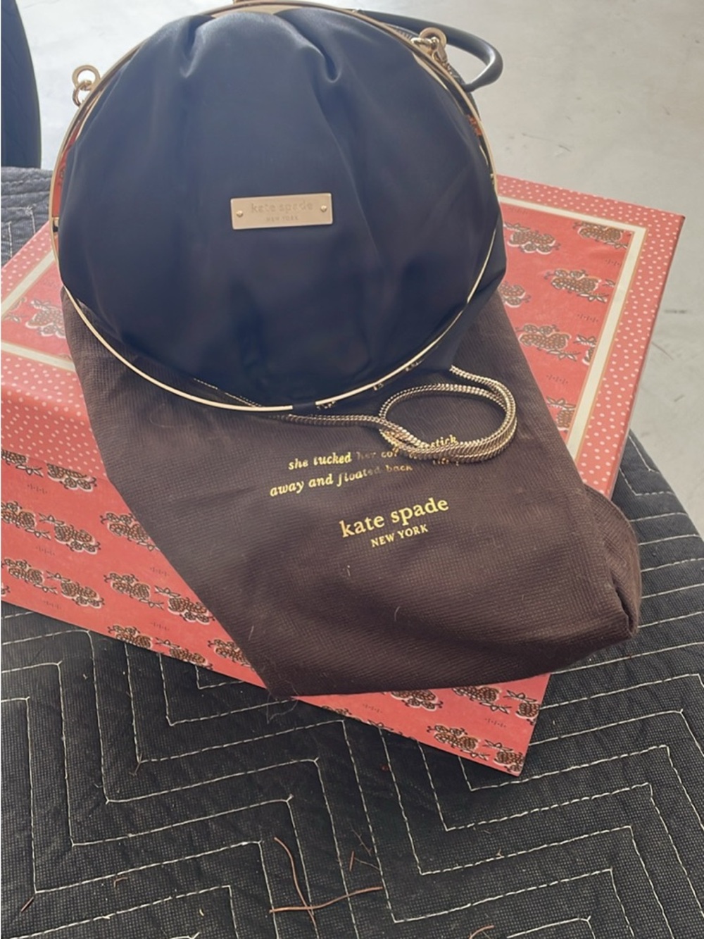 kate spade black round crossbody with gold hardware